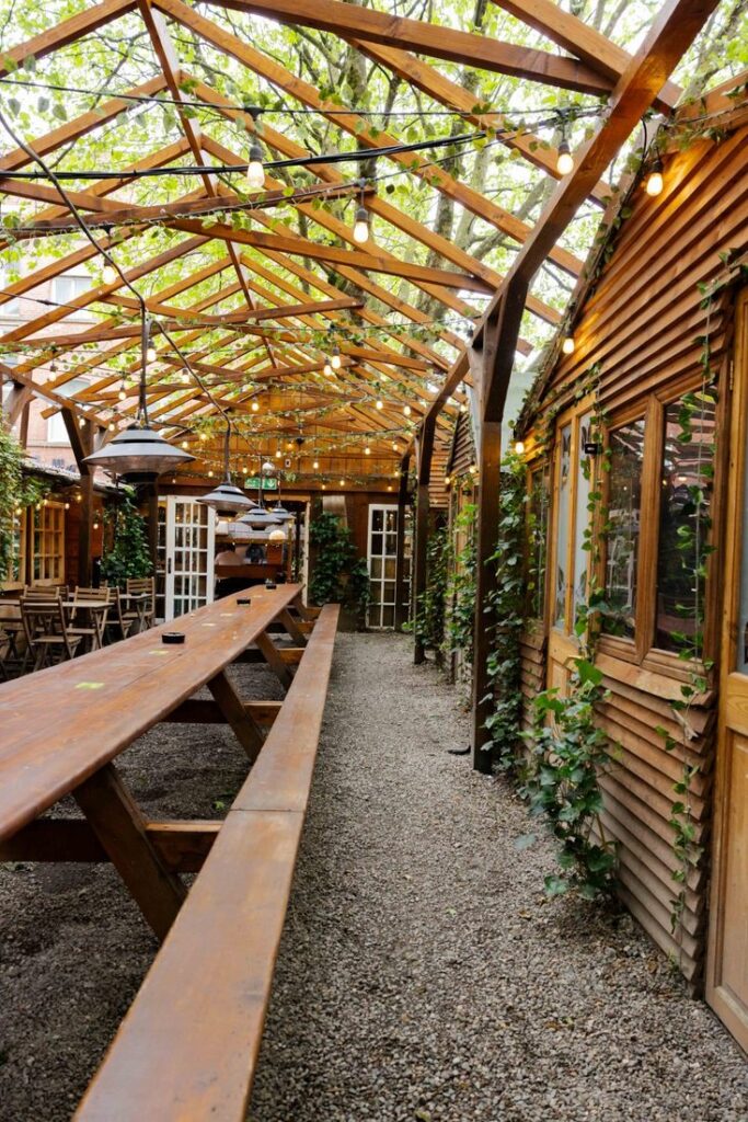 Greenhouse garden walkway strung with plants