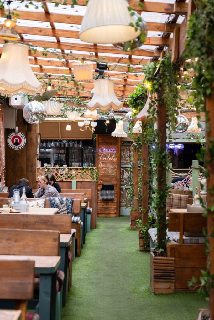 Cosy garden bar seating with fairy lights