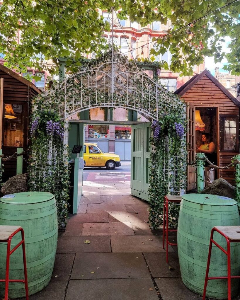 The green archway entrance to Mala Manchester